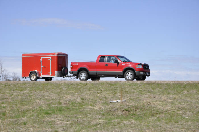 Pickup Truck Towing Small Enclosed Trailer