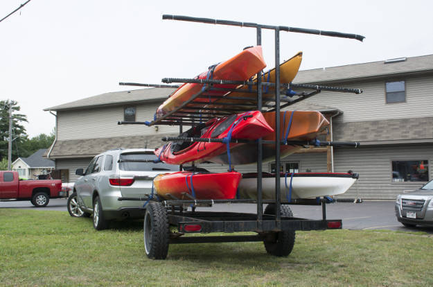 SUV Towing Kayak Trailer Parking Lot