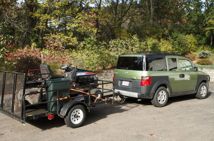 SUV Towing Small Landscape Utility Trailer