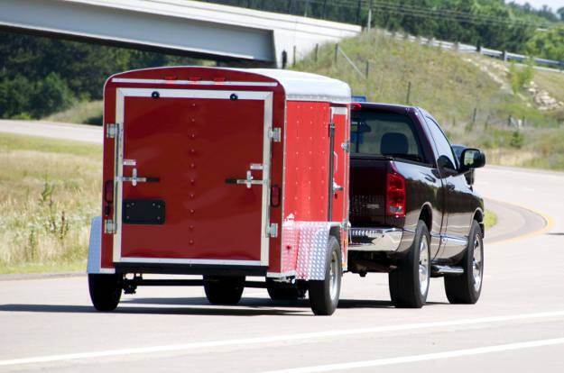 Truck Pulling Enclosed Utility Trailer