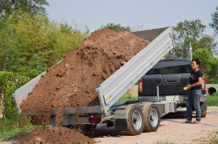 Unloading Dump Trailer Full of Dirt